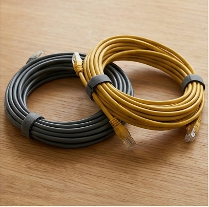 AI-generated editorial illustration: dark and mustard ethernet cable coils.