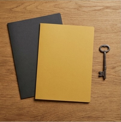 AI-generated editorial illustration: mustard and charcoal folders beside a key.