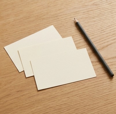 AI-generated editorial illustration: three blank research cards and pen.