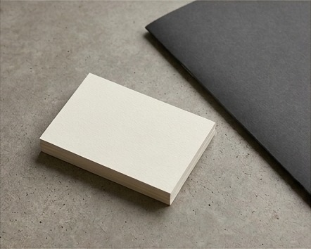 AI editorial photograph of blank design cards and licensed asset folder