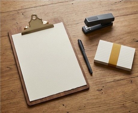 AI editorial photograph of blank review sheet with pen
