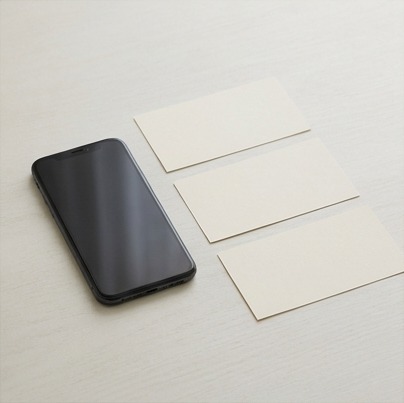 AI editorial photograph of phone beside accessible-layout planning cards