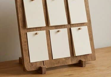 AI-generated editorial illustration: physical board with blank task cards.
