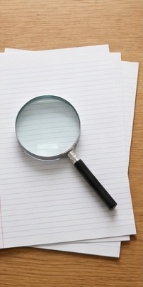 AI-generated editorial illustration: magnifying glass over blank ruled sheets.